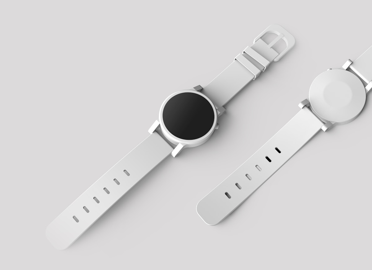 Two fitness watches with silicone straps, representing wrist-worn sensors used for sleep and recovery tracking